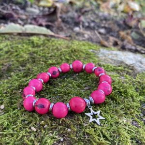 Bracelet graines d'açai roses breloque étoile