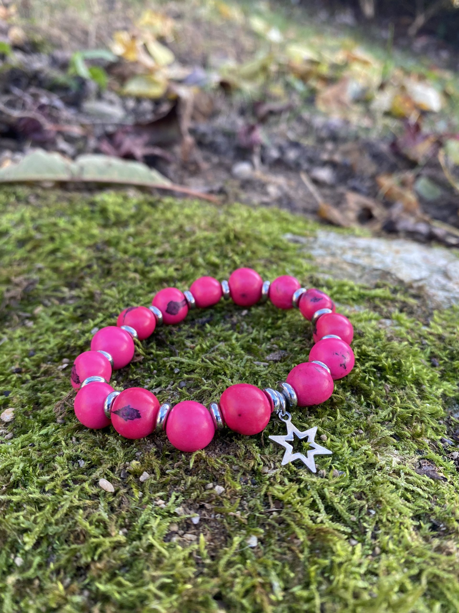 Bracelet graines d'açai roses breloque étoile