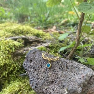 Bague zigzag ajustable doré et strass bleu
